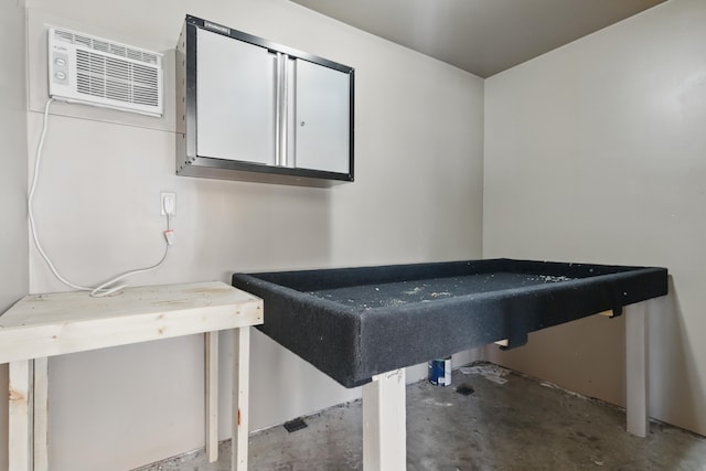5753 Pluto St, Rapid City, SD 57703 - recreation room with concrete floors and a wall unit AC