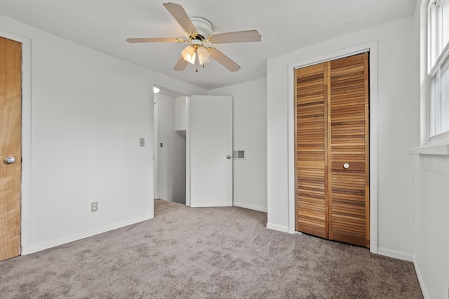 4648 Other, Rapid City, SD 57703 - unfurnished bedroom featuring carpet flooring, a closet, baseboards, and a ceiling fan