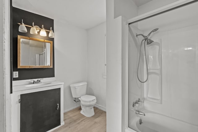 4648 Other, Rapid City, SD 57703 - bathroom featuring toilet, wood finished floors, vanity, baseboards, and bathtub / shower combination