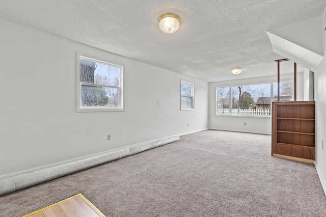 4648 Other, Rapid City, SD 57703 - carpeted empty room with a textured ceiling and baseboards