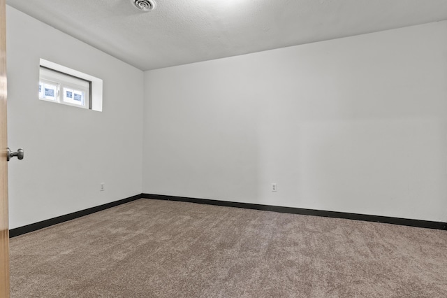 4648 Other, Rapid City, SD 57703 - empty room with carpet flooring, baseboards, and a textured ceiling