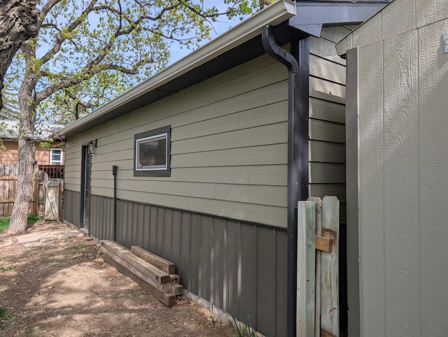view of property exterior featuring fence