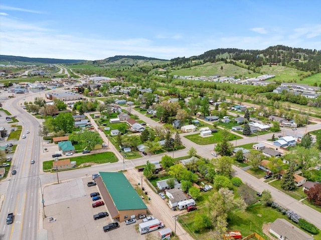 aerial overview of property's location with mountains and nearby suburban area