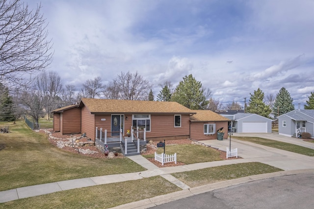 2030 12th Ave, Belle Fourche, SD 57717 - ranch-style house with concrete driveway, a front yard, an outbuilding, and roof with shingles