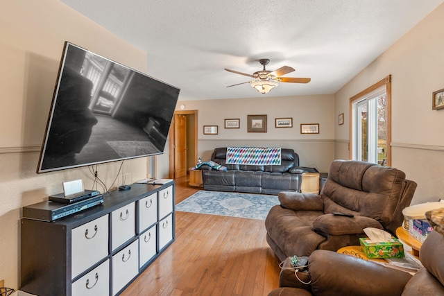 2030 12th Ave, Belle Fourche, SD 57717 - living room featuring light wood-type flooring and a ceiling fan