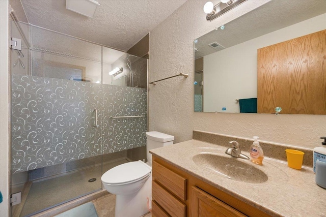 1129 Foothills Rd, Sturgis, SD 57785 - bathroom featuring a textured ceiling, a textured wall, walk in shower, toilet, and vanity