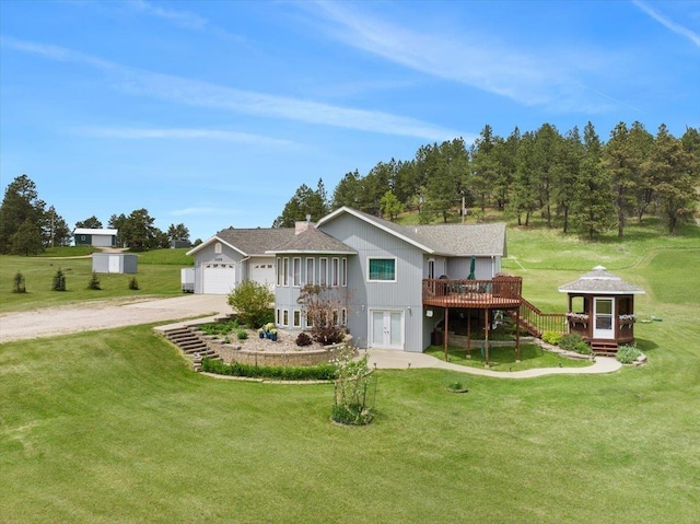 1129 Foothills Rd, Sturgis, SD 57785 - back of house featuring a deck, a gazebo, driveway, a yard, and french doors