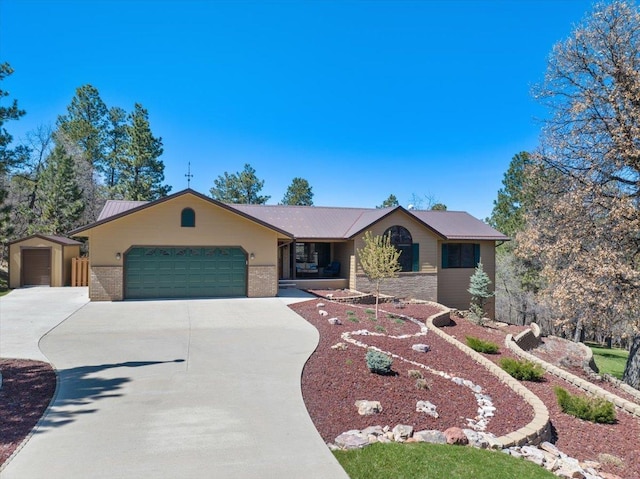 376 Lone Elk Rd, Spearfish, SD 57783 - ranch-style home with a garage, driveway, and brick siding
