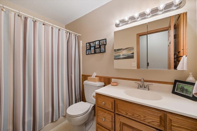 376 Lone Elk Rd, Spearfish, SD 57783 - full bathroom with toilet, vanity, a shower with curtain, and a textured ceiling