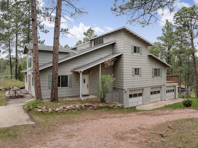 24227 Pine Grove Rd, Rapid City, SD 57702 - view of front facade with driveway and a garage