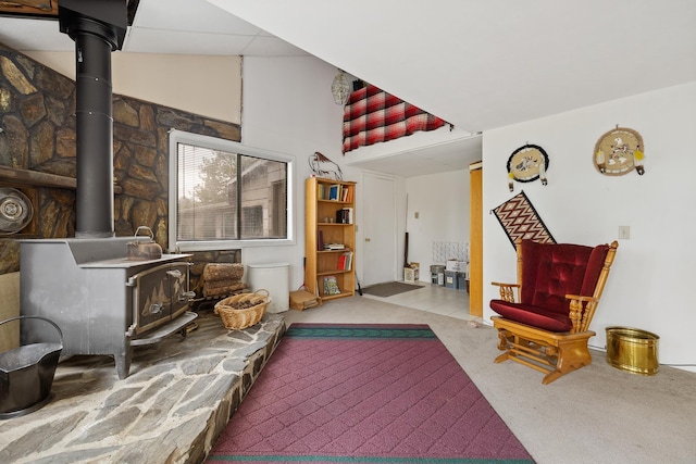 24227 Pine Grove Rd, Rapid City, SD 57702 - sitting room featuring a wood stove and carpet floors