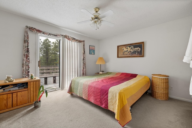 24227 Pine Grove Rd, Rapid City, SD 57702 - carpeted bedroom with access to outside, a textured ceiling, and ceiling fan