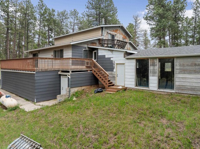 24227 Pine Grove Rd, Rapid City, SD 57702 - rear view of house with stairs, a lawn, and a deck
