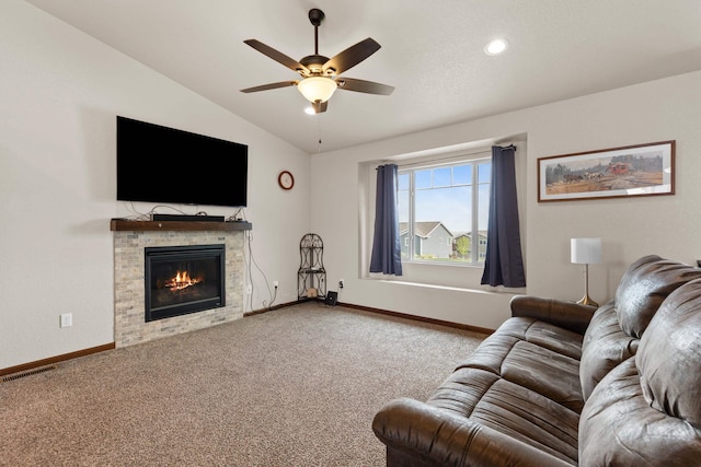 3012 Allison Ln, Rapid City, SD 57703 - living area featuring carpet flooring, baseboards, a ceiling fan, vaulted ceiling, and a glass covered fireplace
