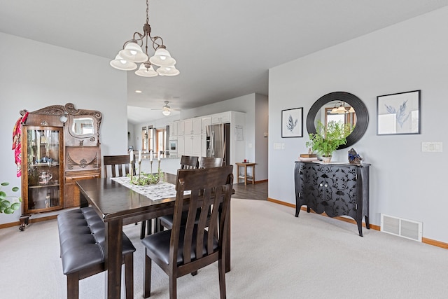 7725 Other, Rapid City, SD 57702 - dining area with a chandelier, baseboards, light carpet, and a ceiling fan