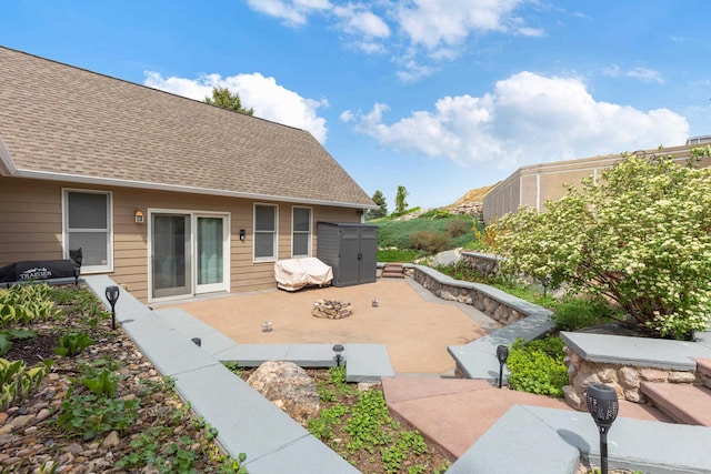 7725 Other, Rapid City, SD 57702 - view of patio featuring a storage unit and an outdoor structure
