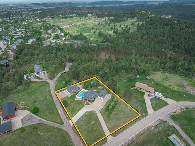 8510 Clarkson Rd, Rapid City, SD 57702 - aerial overview of property's location featuring a heavily wooded area and property parcel outlined