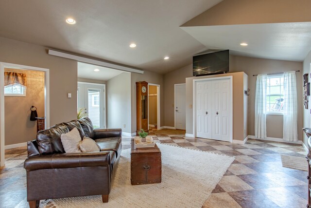 8510 Clarkson Rd, Rapid City, SD 57702 - living room with lofted ceiling, baseboards, and recessed lighting