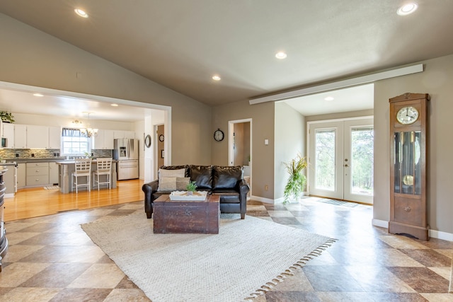 8510 Clarkson Rd, Rapid City, SD 57702 - living room featuring recessed lighting, baseboards, french doors, vaulted ceiling, and a chandelier
