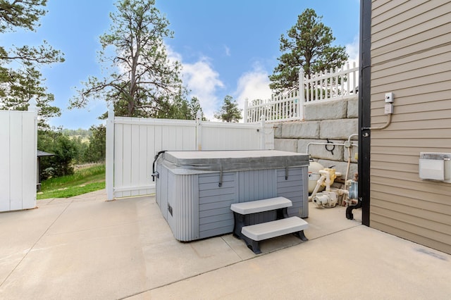 8510 Clarkson Rd, Rapid City, SD 57702 - view of patio featuring a hot tub and fence