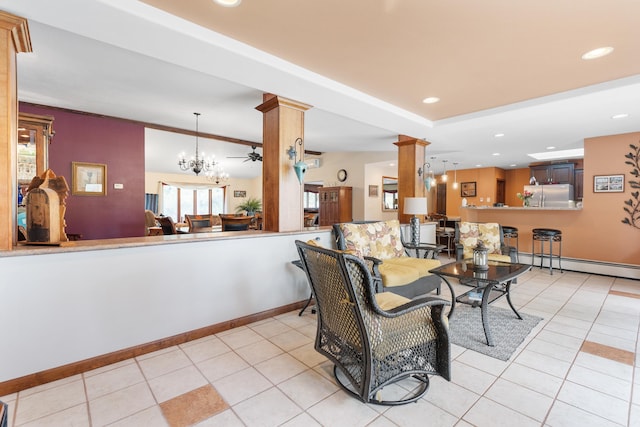 22994 Shields Rd, Rapid City, SD 57702 - living area featuring ornate columns, light tile patterned floors, baseboards, recessed lighting, and a baseboard radiator