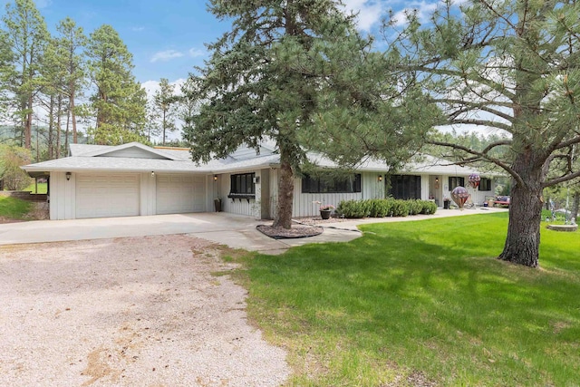 22994 Shields Rd, Rapid City, SD 57702 - ranch-style home with a garage, driveway, and a front yard