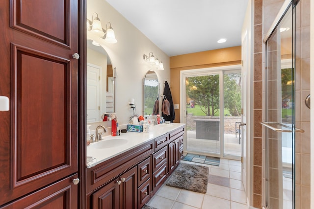 22994 Shields Rd, Rapid City, SD 57702 - bathroom with tile patterned floors, tiled shower, and double vanity