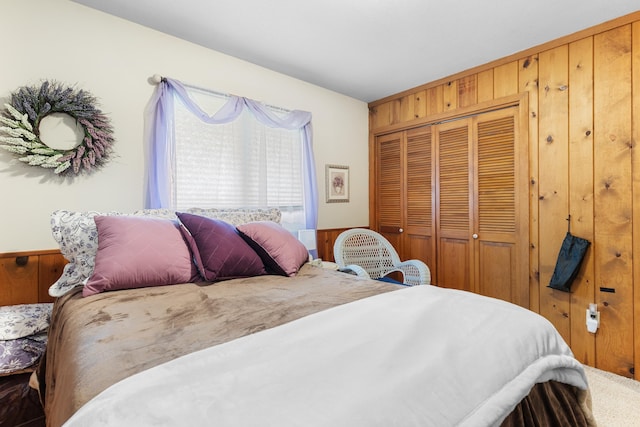 22994 Shields Rd, Rapid City, SD 57702 - bedroom featuring a closet and wood walls