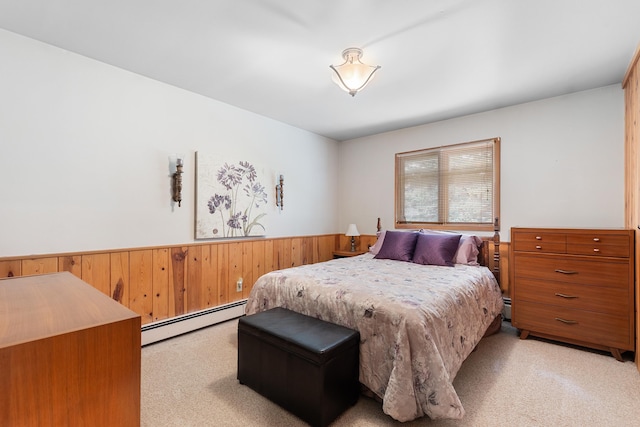 22994 Shields Rd, Rapid City, SD 57702 - bedroom with a baseboard radiator, light carpet, wainscoting, and wood walls