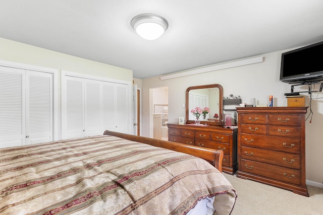 22994 Shields Rd, Rapid City, SD 57702 - bedroom featuring multiple closets and light colored carpet