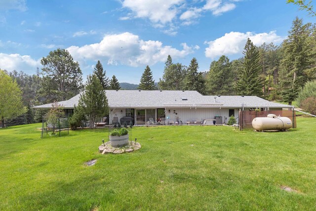 22994 Shields Rd, Rapid City, SD 57702 - back of house featuring a lawn