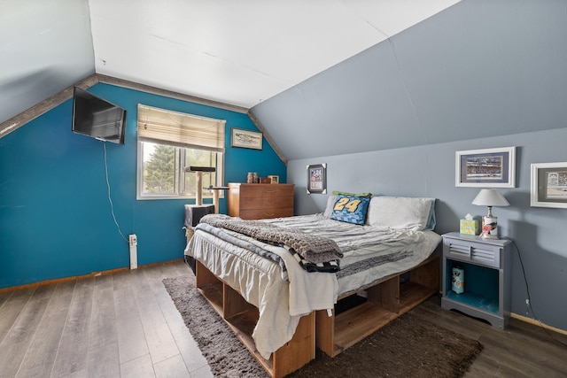 2101 Juniper Dr, Rapid City, SD 57702 - bedroom with wood finished floors and vaulted ceiling