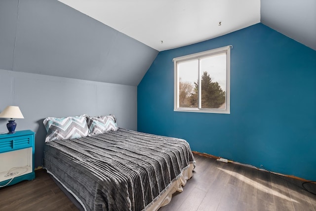 2101 Juniper Dr, Rapid City, SD 57702 - bedroom featuring vaulted ceiling and wood finished floors