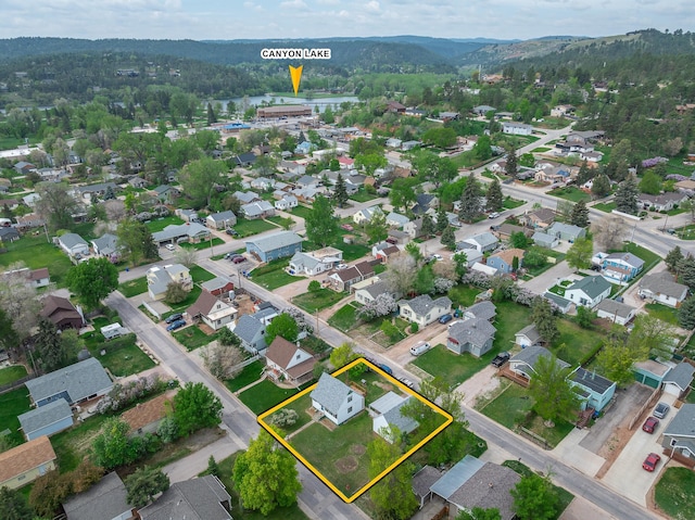 2101 Juniper Dr, Rapid City, SD 57702 - aerial perspective of suburban area featuring property boundaries highlighted and a heavily wooded area