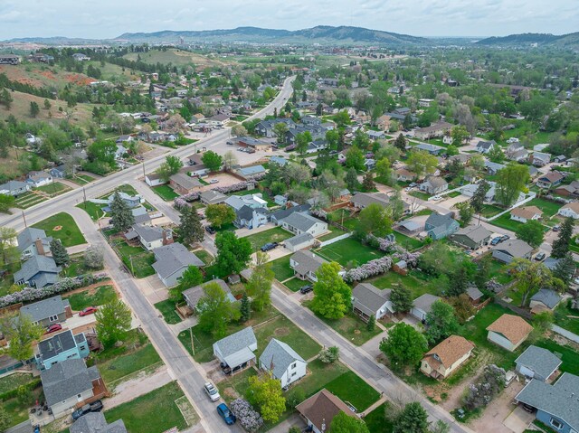 2101 Juniper Dr, Rapid City, SD 57702 - aerial view of property's location with a mountain backdrop and nearby suburban area