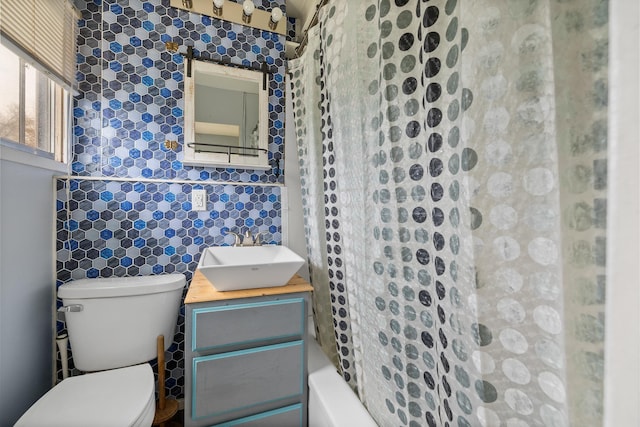 2101 Juniper Dr, Rapid City, SD 57702 - full bathroom with toilet, vanity, and tile walls