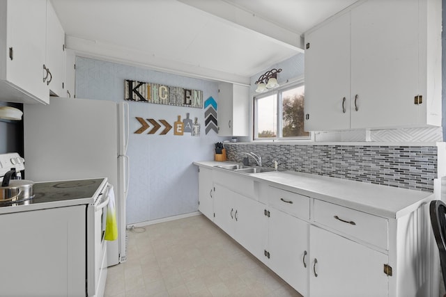 2101 Juniper Dr, Rapid City, SD 57702 - kitchen featuring electric stove, a sink, light countertops, white cabinetry, and tasteful backsplash
