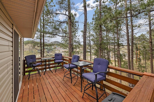 123 Gordon St, Custer, SD 57730 - wooden deck featuring outdoor dining area