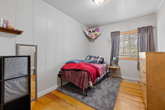 123 Gordon St, Custer, SD 57730 - bedroom with wood finished floors, crown molding, and baseboards