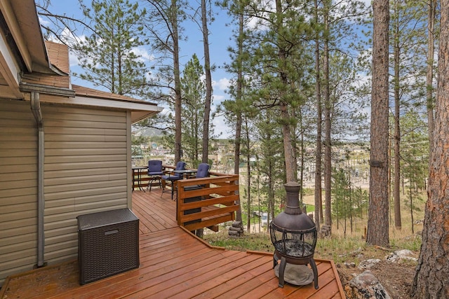 123 Gordon St, Custer, SD 57730 - wooden terrace with an outdoor fire pit
