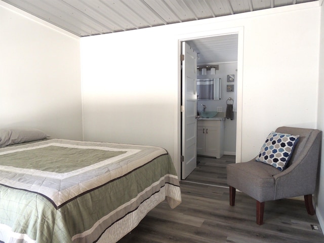 123 Gordon St, Custer, SD 57730 - bedroom with wood finished floors and ensuite bathroom