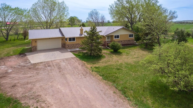 15630 Antelope Creek Rd, Rapid City, SD 57703 - single story home featuring driveway, stone siding, a garage, a chimney, and metal roof