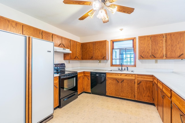 15630 Antelope Creek Rd, Rapid City, SD 57703 - kitchen featuring black appliances, a sink, under cabinet range hood, and brown cabinets