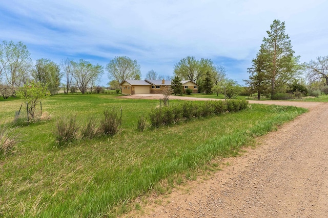 15630 Antelope Creek Rd, Rapid City, SD 57703 - view of yard with dirt driveway, a garage, and a view of countryside