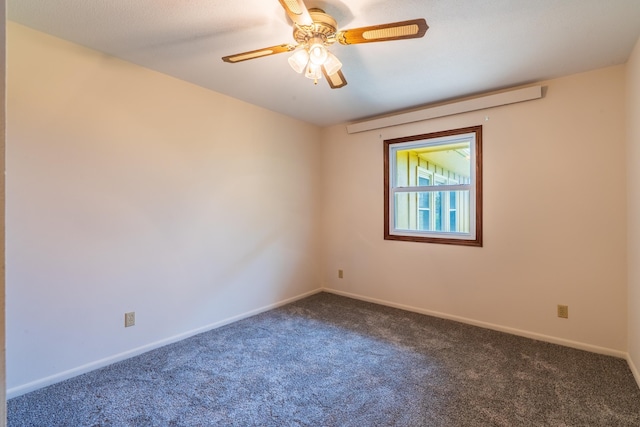15630 Antelope Creek Rd, Rapid City, SD 57703 - unfurnished room with dark colored carpet, baseboards, and ceiling fan