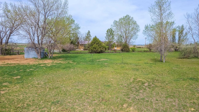 15630 Antelope Creek Rd, Rapid City, SD 57703 - view of green lawn with an outbuilding and a storage unit