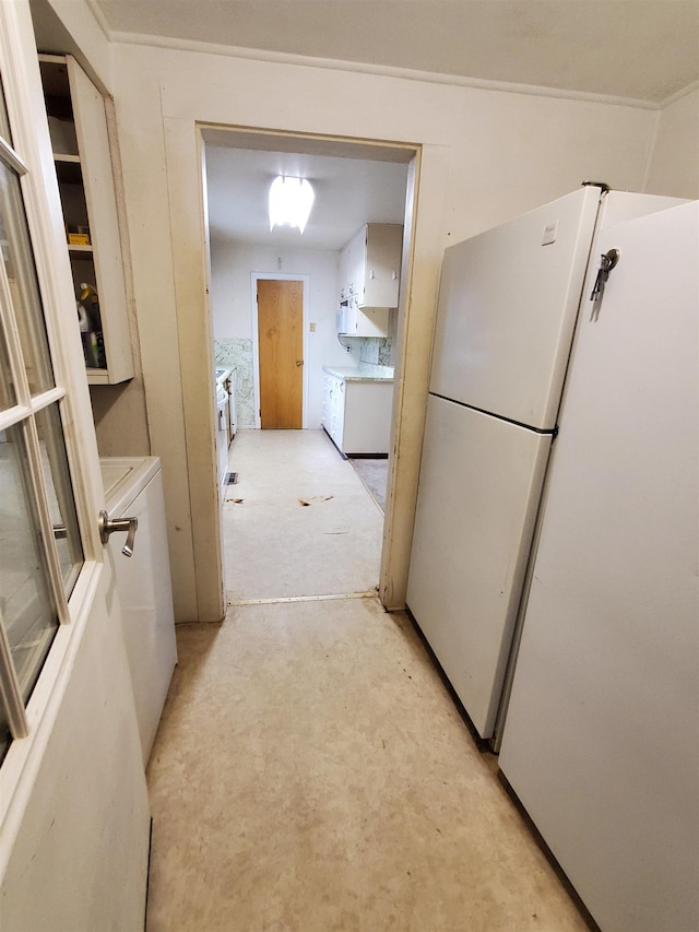 400 5th Ave, Edgemont, SD 57735 - hallway featuring washer / clothes dryer and crown molding