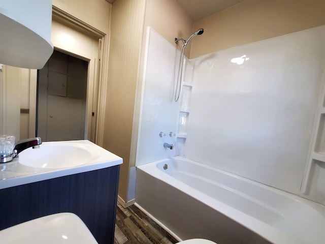 105 N Washington St, Edgemont, SD 57735 - full bath with a sink, wood finished floors, and bathtub / shower combination