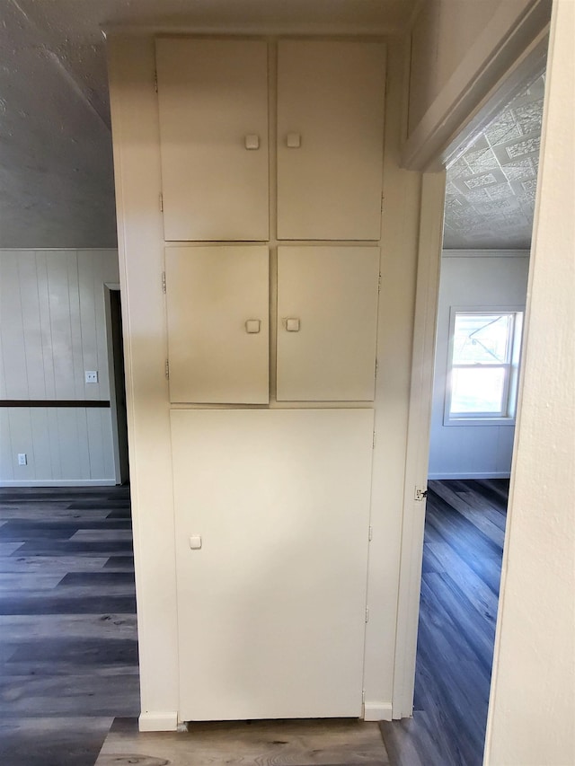 105 N Washington St, Edgemont, SD 57735 - detailed view of wood finished floors, baseboards, and ornamental molding