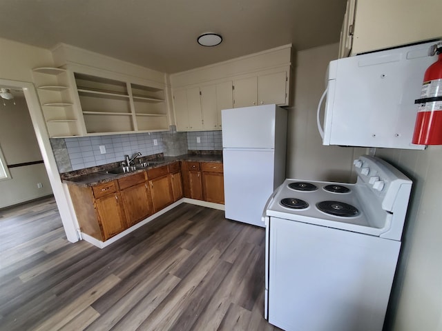 105 N Washington St, Edgemont, SD 57735 - kitchen with white appliances, a sink, open shelves, and dark wood-type flooring